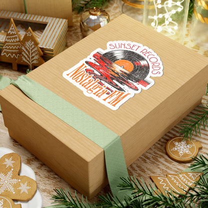 Wooden gift box with a 'Sunset Records' sticker on a festive background with cookies and decorations.