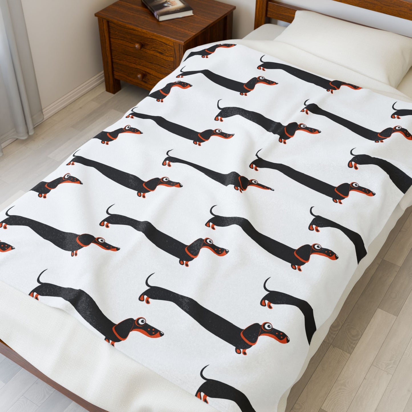 Dachshund blanket on bed in a bedroom