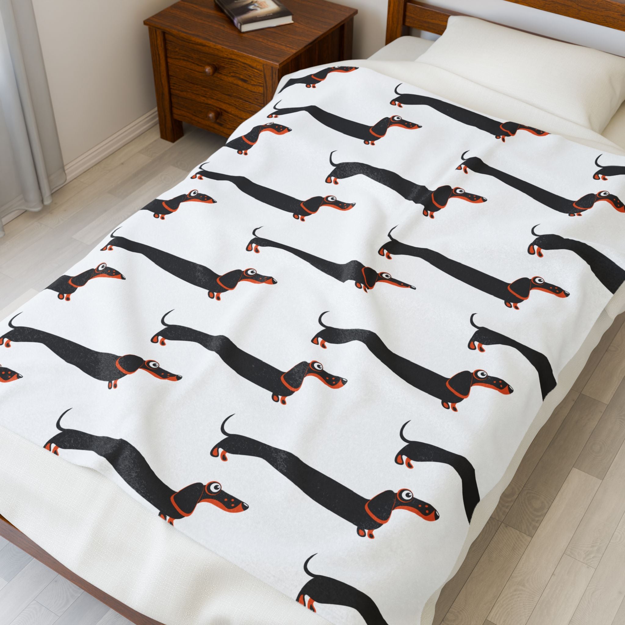 Dachshund blanket on bed in a bedroom