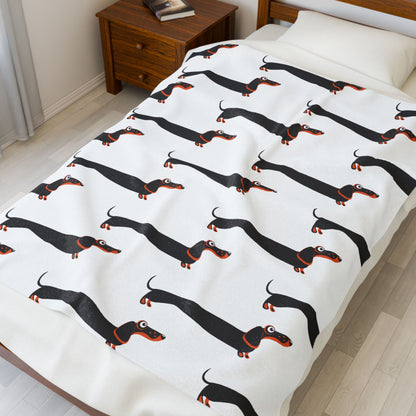 Dachshund blanket on bed in a bedroom
