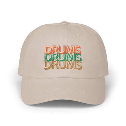 Beige cap with 'DRUMS' text in multiple colors on a white background