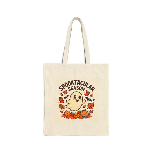 Tote bag with 'Spooktacular Season' design featuring a ghost, pumpkins, and leaves on a white background.