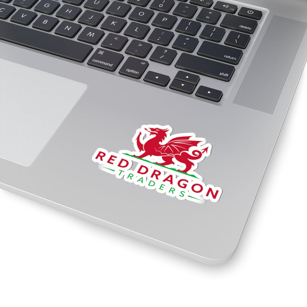 Laptop with a 'Red Dragon Traders' sticker on the palm rest area