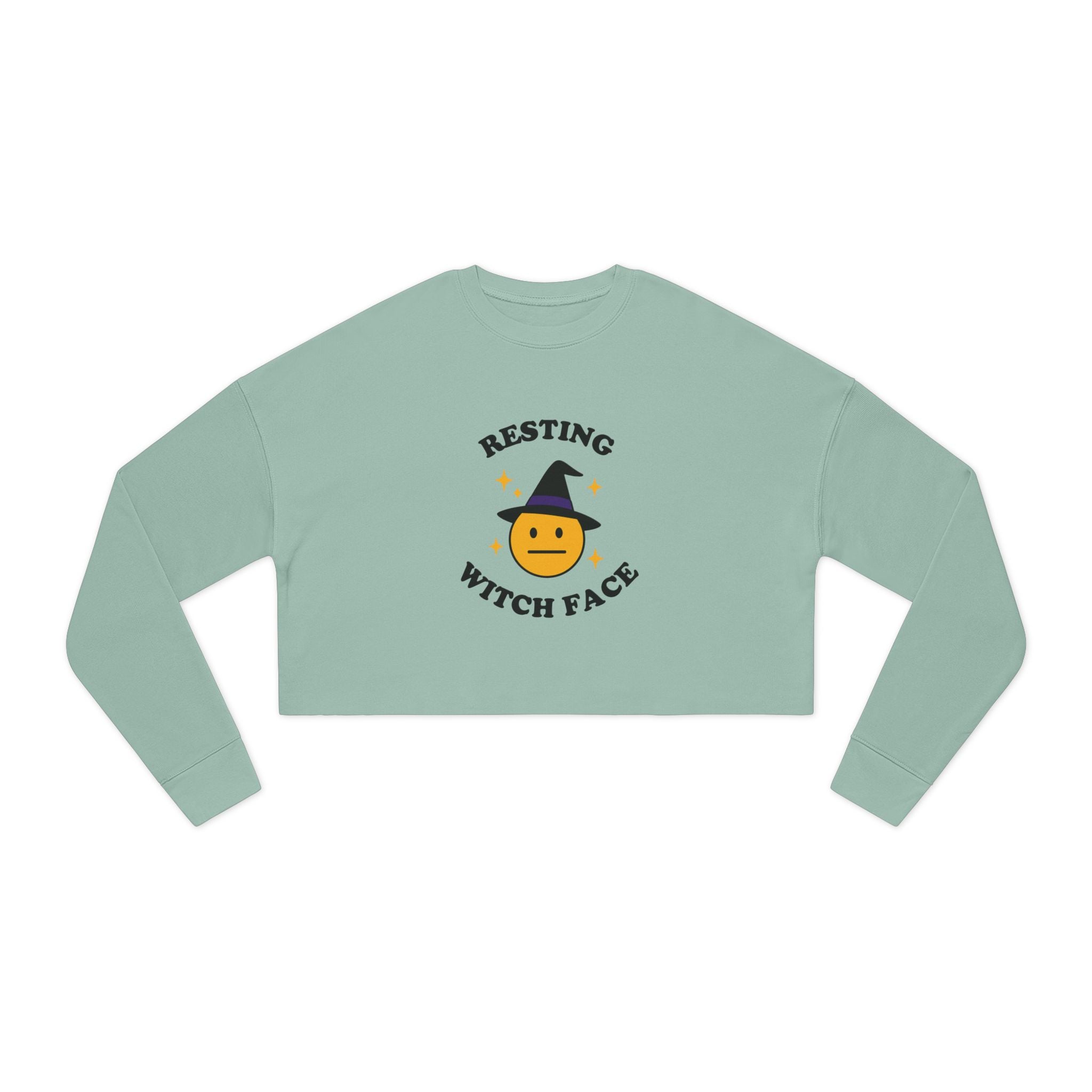 Light green long-sleeve crop top with 'Resting Witch Face' graphic on a white background