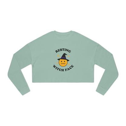 Light green long-sleeve crop top with 'Resting Witch Face' graphic on a white background