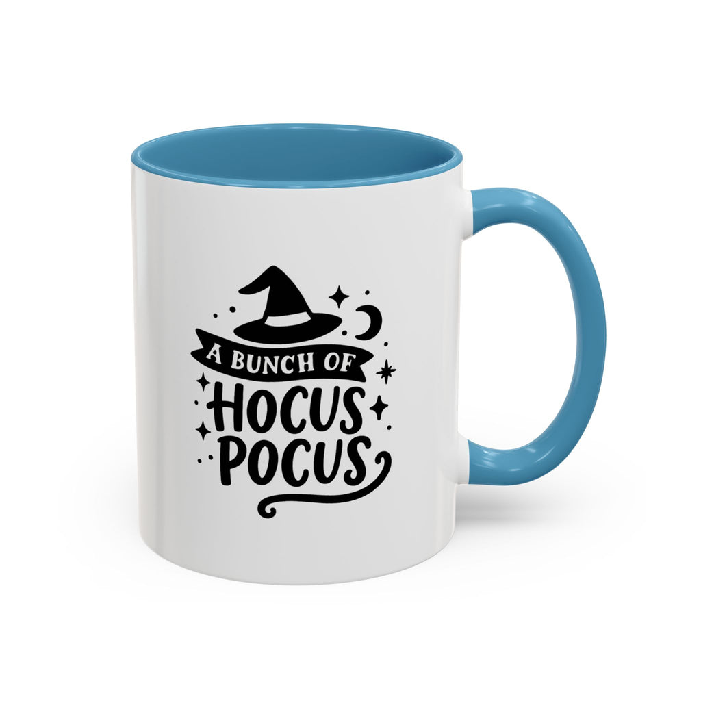White two-tone coffee mug with a light blue handle and interior and a black 'A Bunch of Hocus Pocus' witch-hat design, on a white background