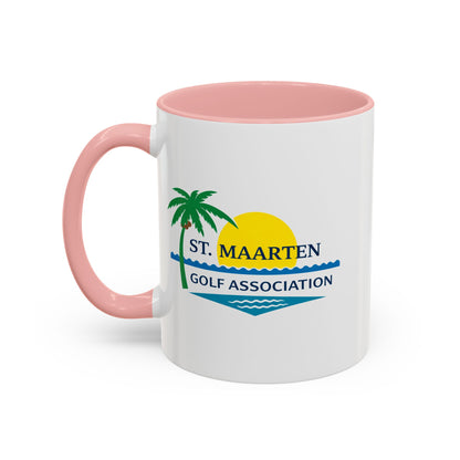 White mug with pink handle and interior, featuring St. Maarten Golf Association logo.