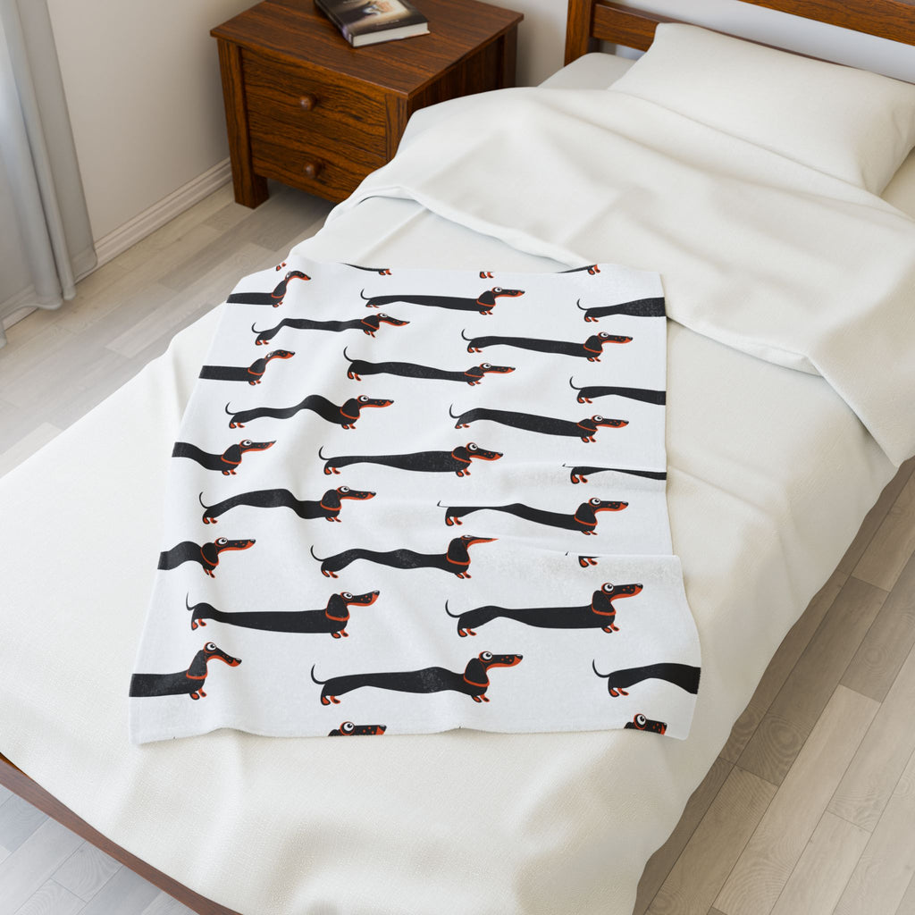 Dachshund blanket on small bed 