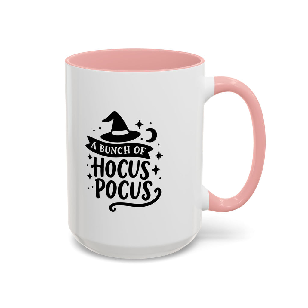 White two-tone coffee mug with a pink handle and interior and a black 'A Bunch of Hocus Pocus' witch-hat design, on a white background