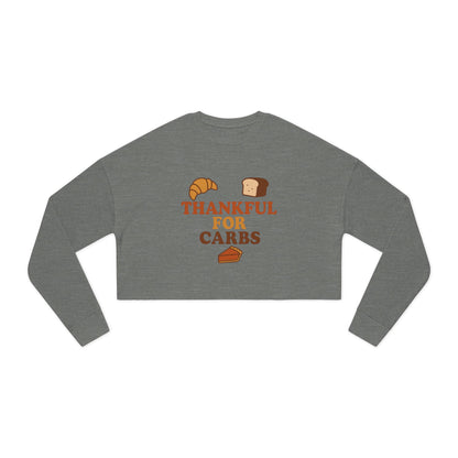 Gray long-sleeve crop top with 'Thankful for Carbs' text and food graphics on a white background