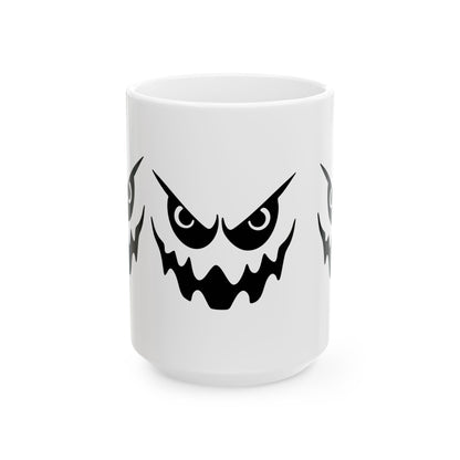 White mug with a black angry face design on a white background