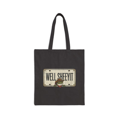 Dark gray canvas tote bag with a 'Well Sheeyit' license-plate graphic and a cartoon cowboy frog