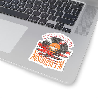 Sticker with 'Sunset Records Nostalgia FM' design on a laptop