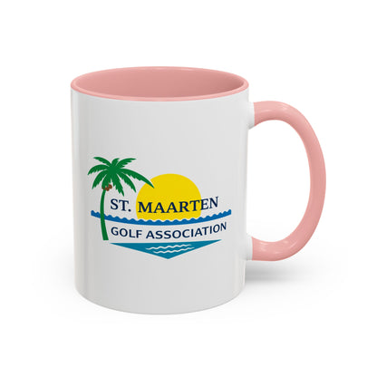 White mug with pink interior and handle featuring St. Maarten Golf Association logo.