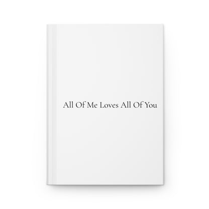 White book with black text 'All Of Me Loves All Of You' on a white background