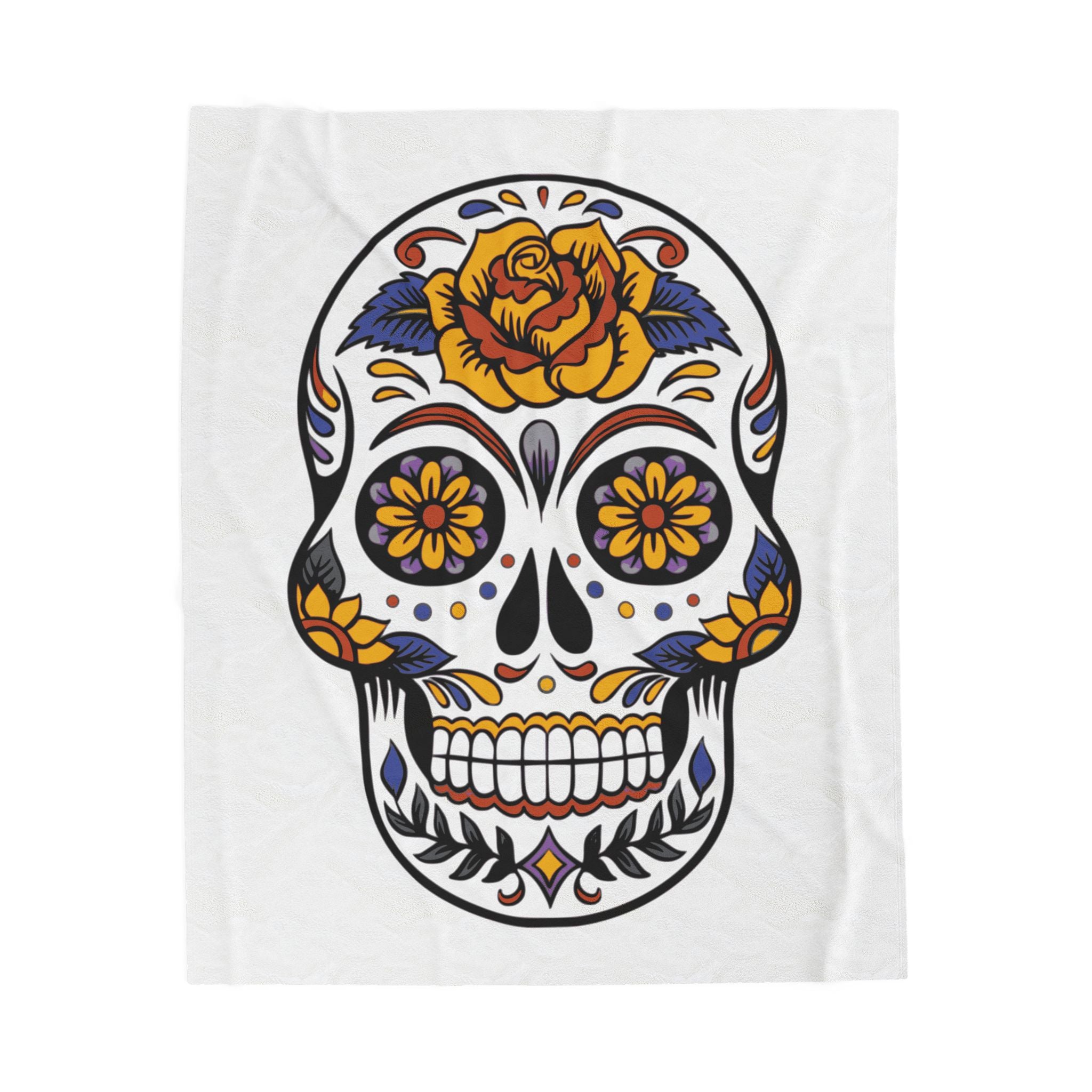 Sugar skull blanket with olorful design with a rose on a white background