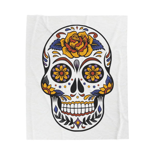 Sugar skull blanket with olorful design with a rose on a white background