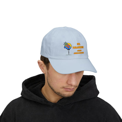 Person wearing a light blue cap with a colorful design and text on a white background