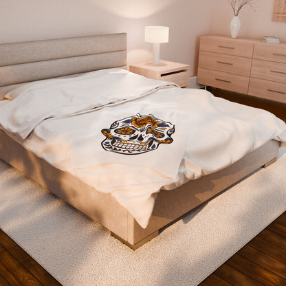 Sugar skull blanket on a bed in a bedroom setting