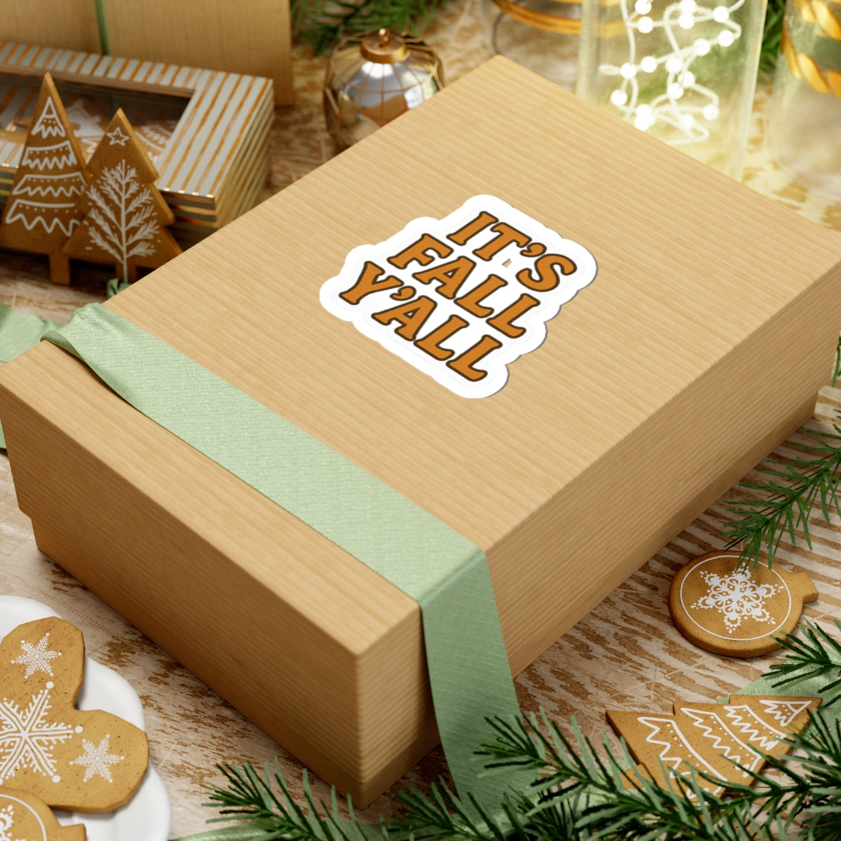 Wooden box with 'It's Fall Y'all' sticker on a festive background with cookies and greenery