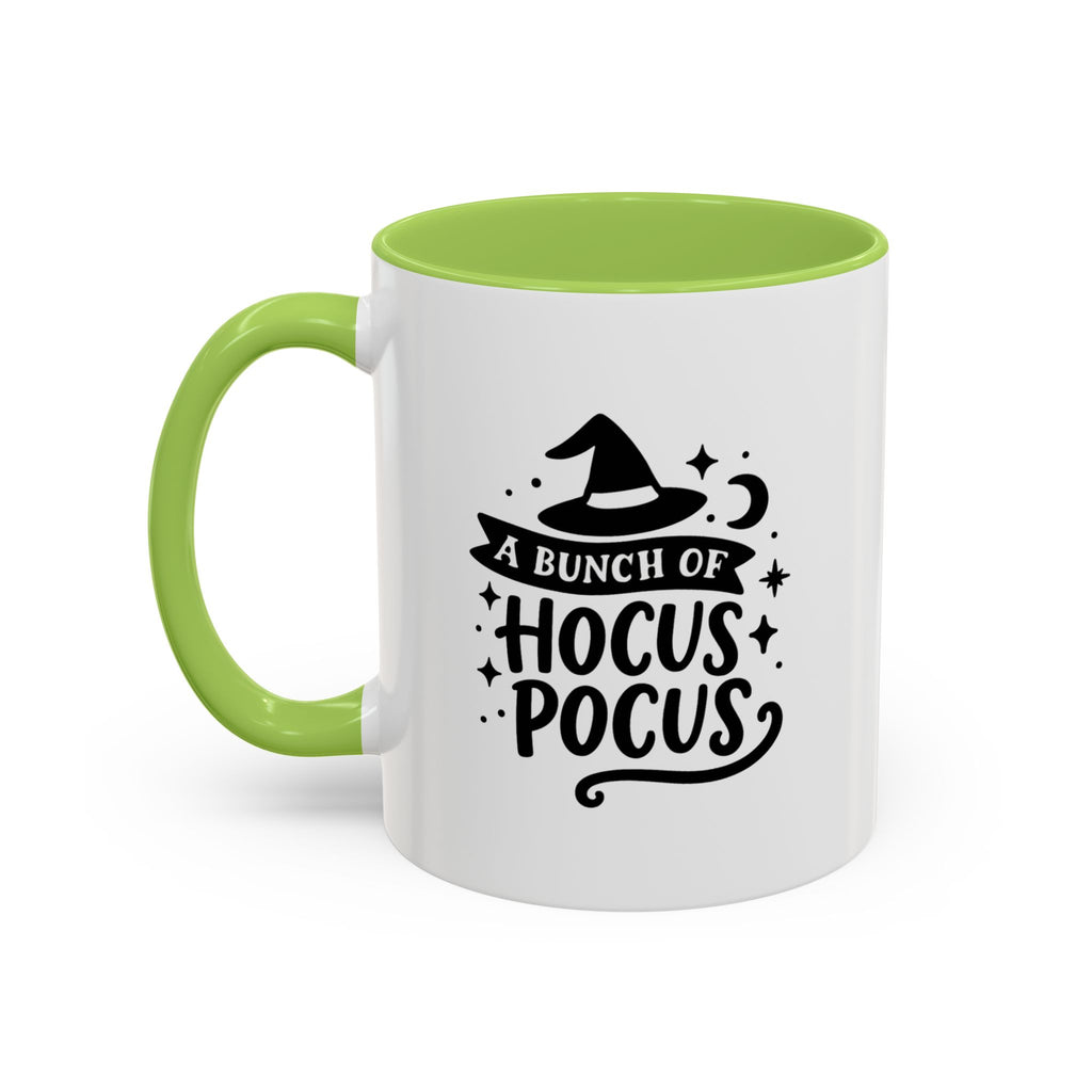 White two-tone coffee mug with a light green handle and interior and a black 'A Bunch of Hocus Pocus' witch-hat design, on a white background