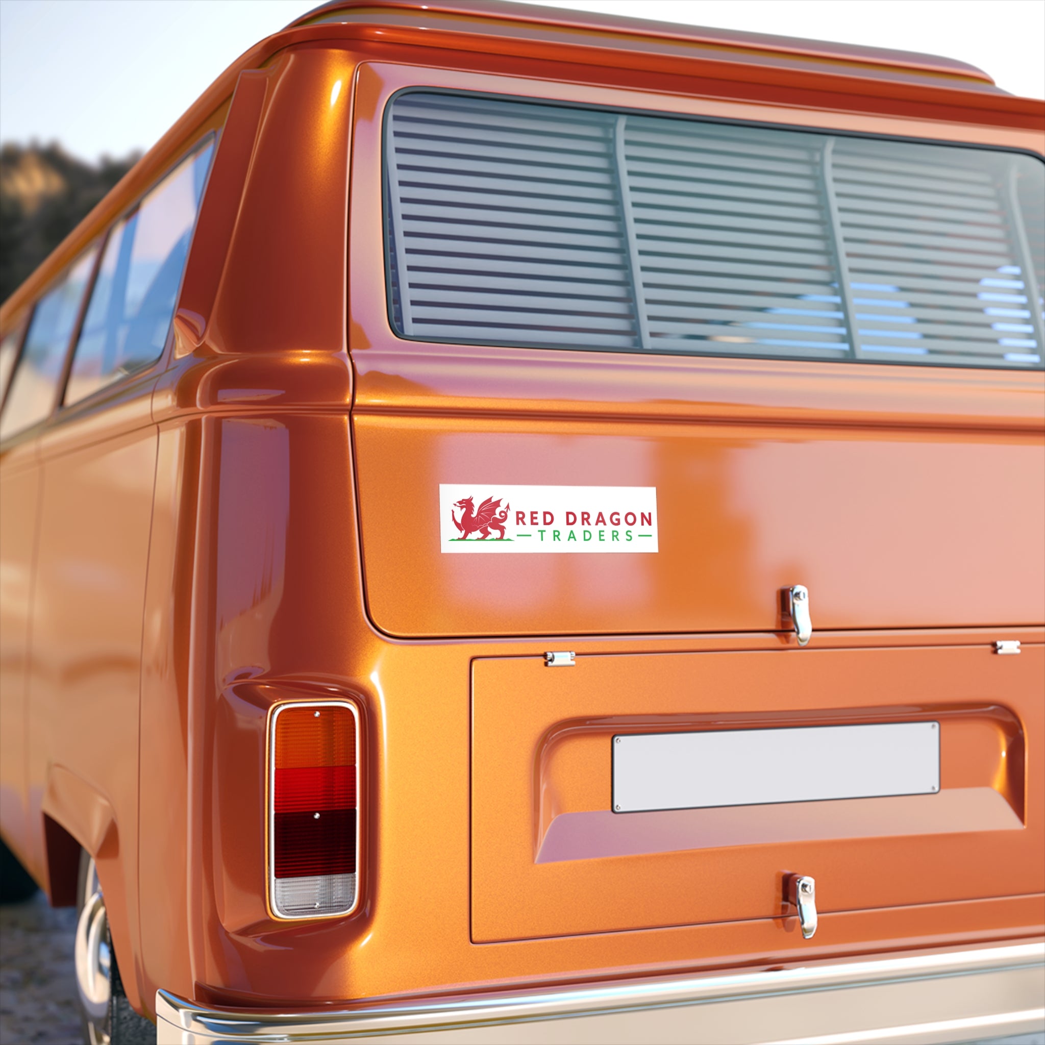 Orange van with a 'Red Dragon Traders' logo on the back