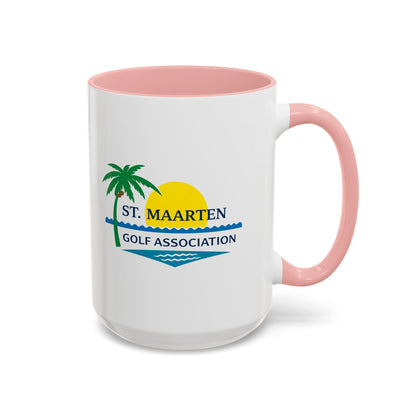 White mug with pink interior and handle featuring St. Maarten Golf Association logo.