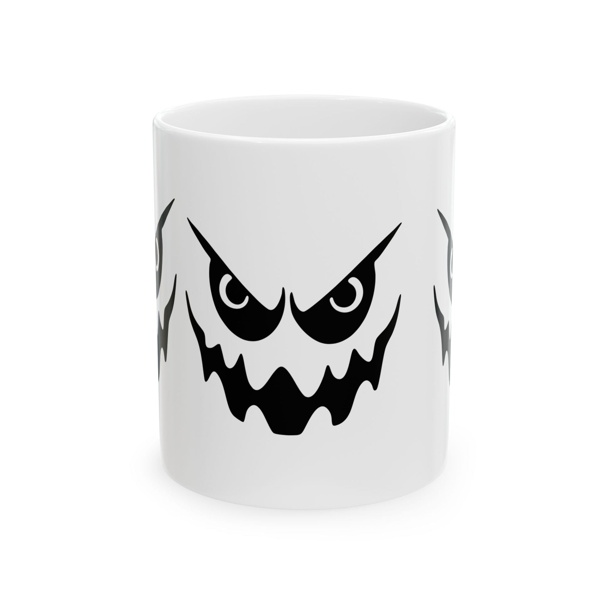 White mug with a black angry face design on a white background