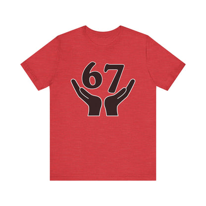 Red t-shirt with black hands holding the number 67 design on a white background