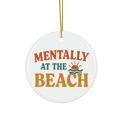 Round ceramic ornament with 'Mentally at the Beach' text and sun and wave design on a white background.