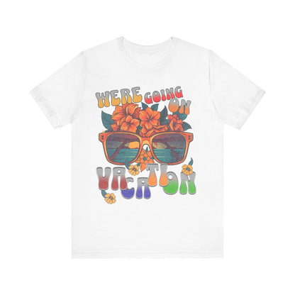 White t-shirt with colorful graphic design featuring sunglasses and text on a white background
