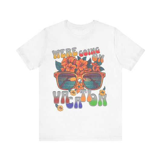 White t-shirt with colorful graphic design featuring sunglasses and text on a white background