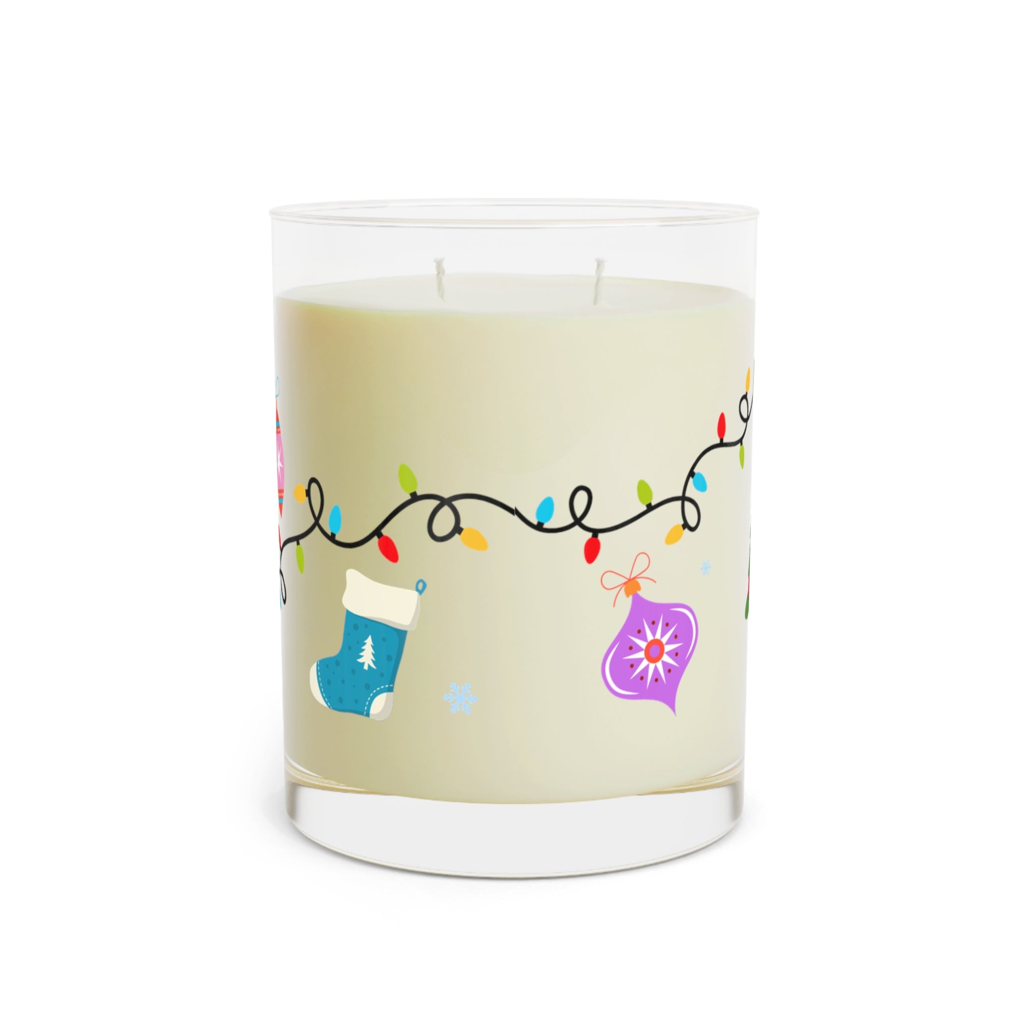 Candle with Christmas-themed design on a beige background