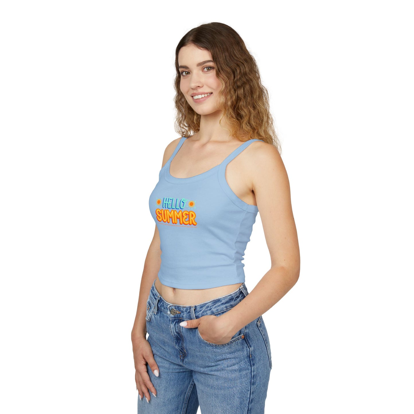 Woman wearing a light blue tank top with pink text and blue jeans on a white background