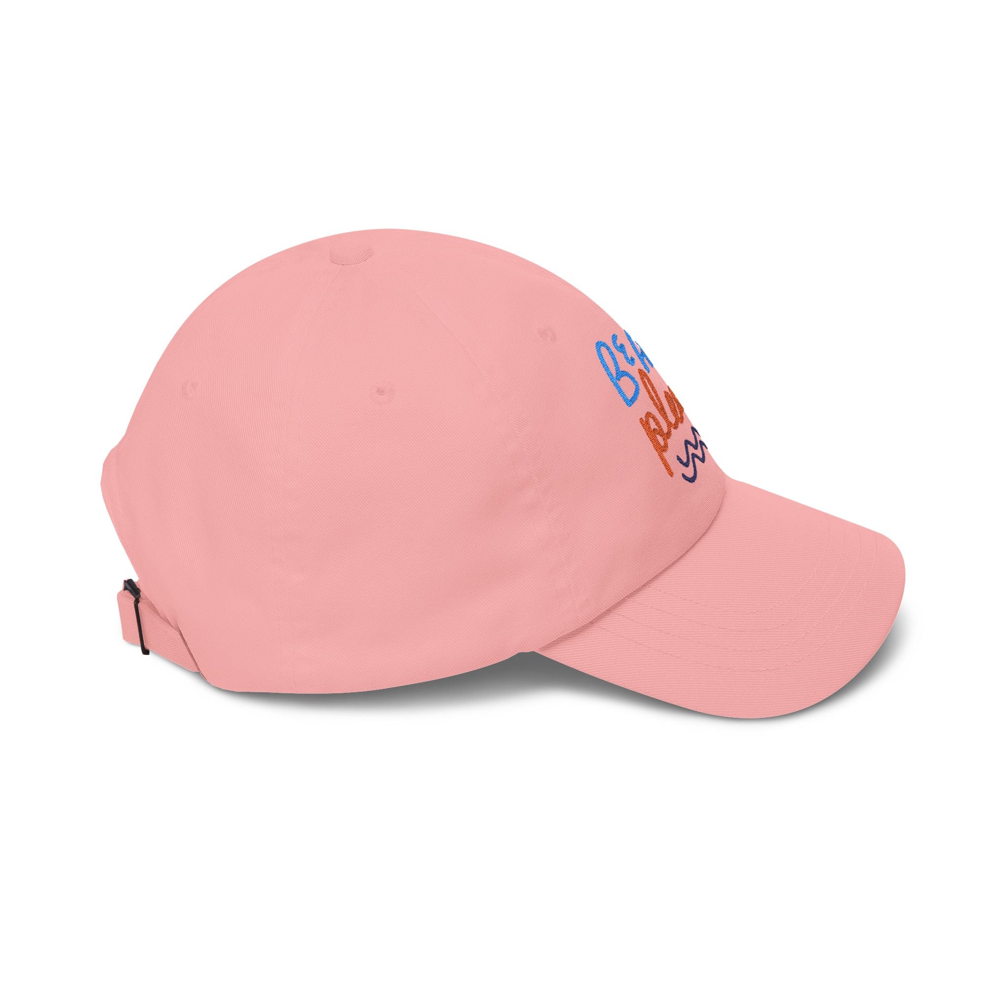 Pink dad cap with embroidered 'Beach Please' text, side view on a white background