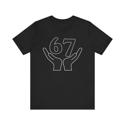 Black t-shirt with white graphic of hands holding the number 67 on a white background