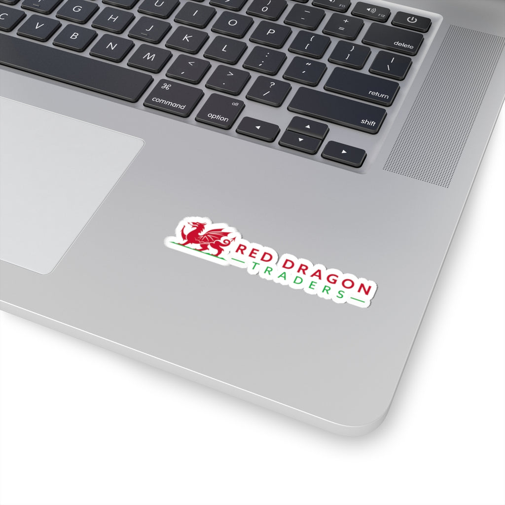 Laptop with a 'Red Dragon Traders' sticker on the palm rest area