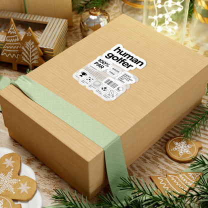 Wooden gift box with a green ribbon and 'human golfer' label, surrounded by festive decor.