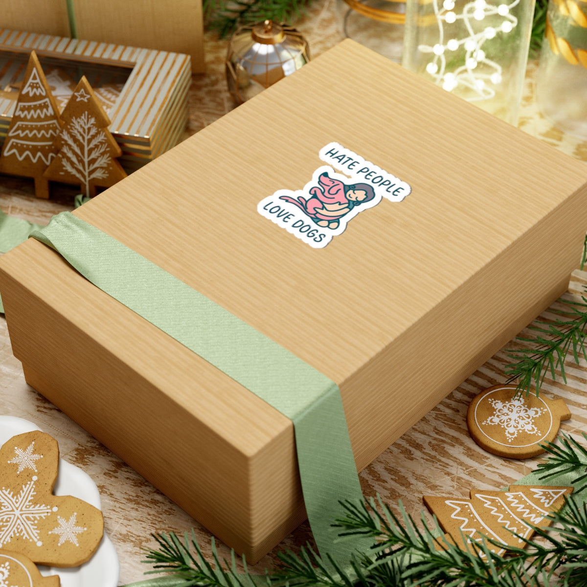 Gift box with a sticker on a festive background with cookies and decorations