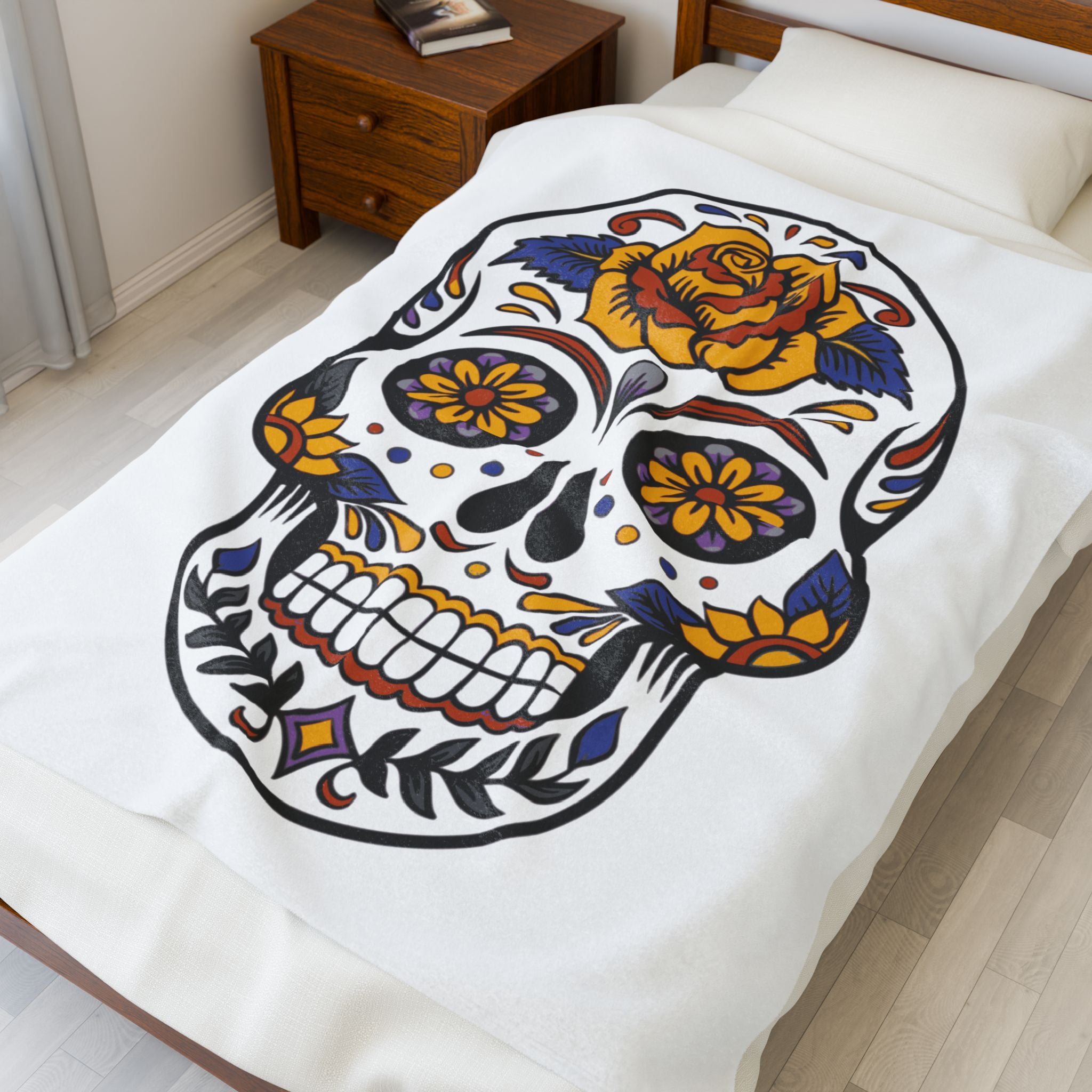 Sugar skull blanket with colorful design blanket on a bed in a bedroom setting