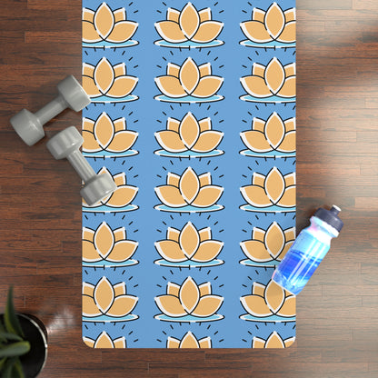 Yoga mat with lotus flower pattern on a wooden floor with dumbbells and a water bottle.