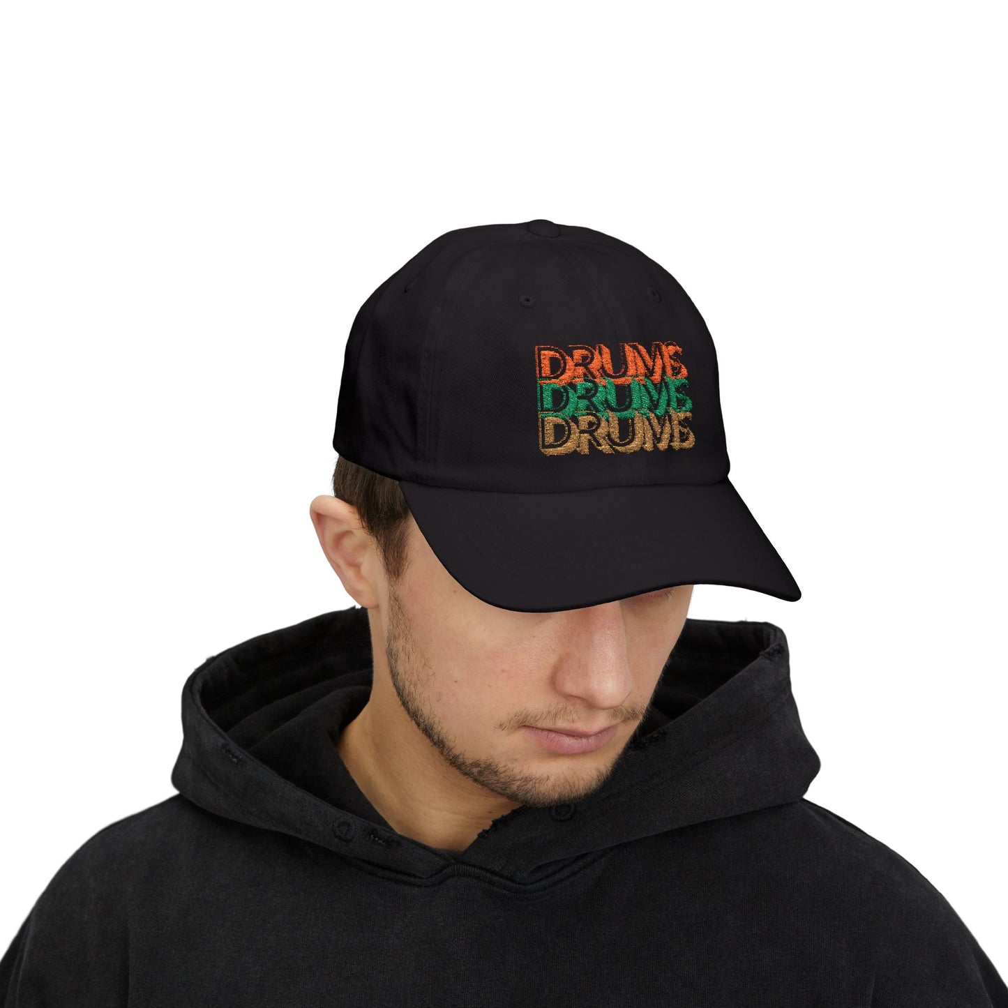 Person wearing a black cap with colorful text on a white background