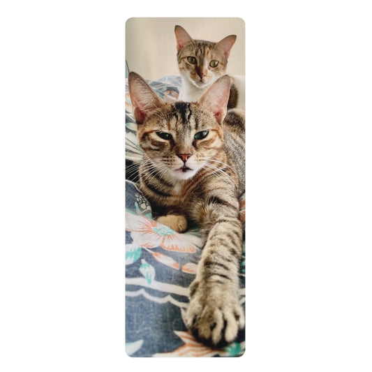 Yoga mat with a design of two cats on a white background