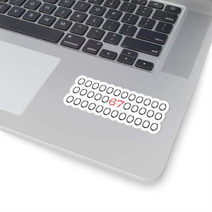 Laptop with a sticker featuring binary code and the number 67 on a white background