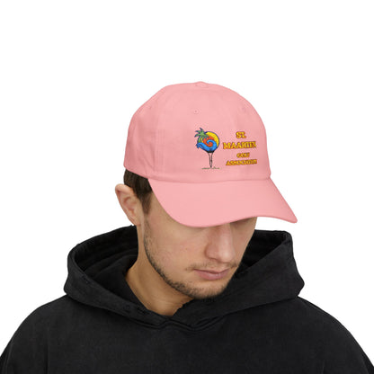 Person wearing a pink cap with a colorful design and text on a white background