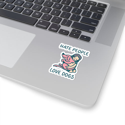 Laptop with a sticker that reads 'Hate people, love dogs' on the palm rest area.