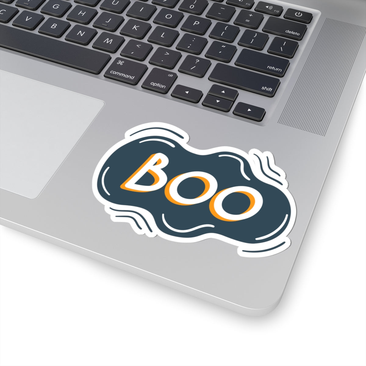 Laptop with a 'BOO' sticker on the palm rest area