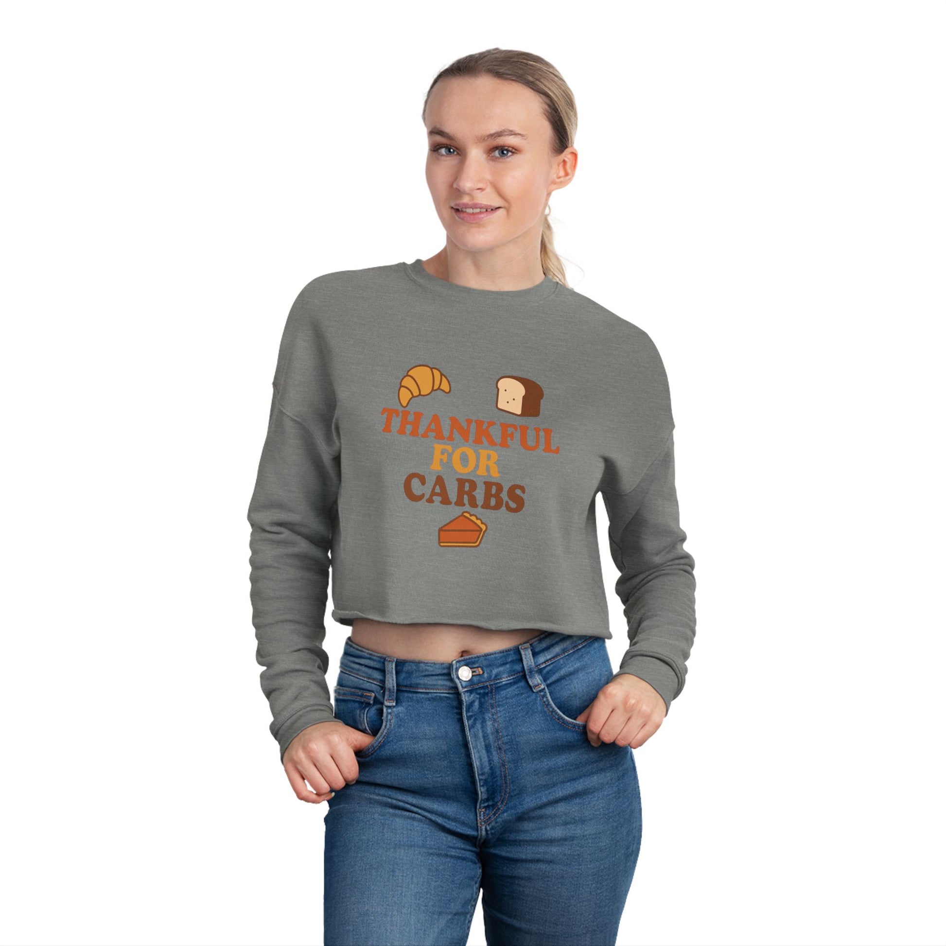Woman wearing a gray sweatshirt with 'Thankful for Carbs' text and food graphics on a white background