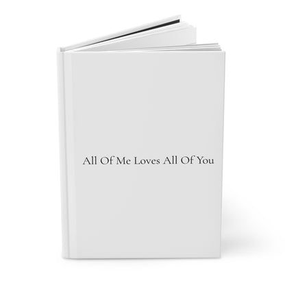 White book with text 'All Of Me Loves All Of You' on a white background