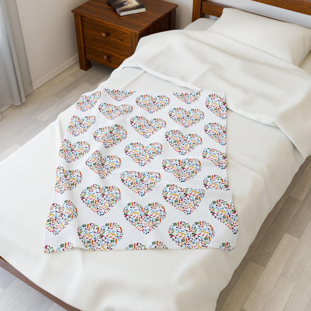 Hearts blanket with playful note and treble clef pattern